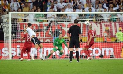 German forward Mario Gomez (2ndL) scores