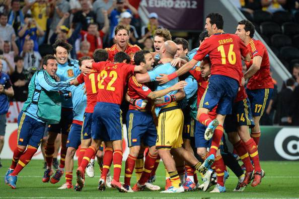 Spanish players celebrate at the end of