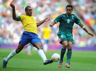 LONDON, ENGLAND - AUGUST 11: Juan Jesus of Brazil (L) battles for the ball with Marco Fabian of Mexico during the Men's Football Final between Brazil and Mexico on Day 15 of the London 2012 Olympic Games at Wembley Stadium on August 11, 2012 in London, England. (Photo by Michael Regan/Getty Images)