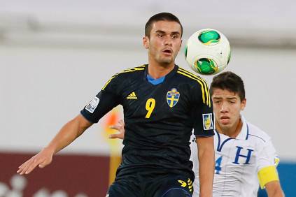 Sweden's Valmir Berisha (L) controls the ball ahead of Honduras' captain Luis Santos (R) during their FIFA U-17 World Cup UAE 2013 football match at Al Ain City on November 1, 2013. Sweden defeated Honduras 2-1. AFP PHOTO/STR        (Photo credit should read -/AFP/Getty Images)