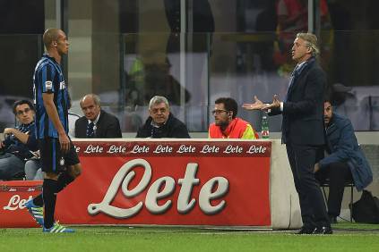 MILAN, ITALY - APRIL 03: Joao Miranda (L) of FC Internazionale Milano walks off after receiving the red card from referee Marco Guida during the Serie A match between FC Internazionale and Torino FC Milano at Stadio Giuseppe Meazza on April 3, 2016 in Milan, Italy. (Photo by Valerio Pennicino/Getty Images)