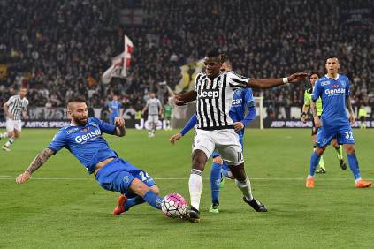 TURIN, ITALY - APRIL 02:  Paul Pogba (R) of Juventus FC is tackled by Lorenzo Tonelli of Empoli FC during the Serie A match between Juventus FC and Empoli FC at Juventus Arena on April 2, 2016 in Turin, Italy.  (Photo by Valerio Pennicino/Getty Images)