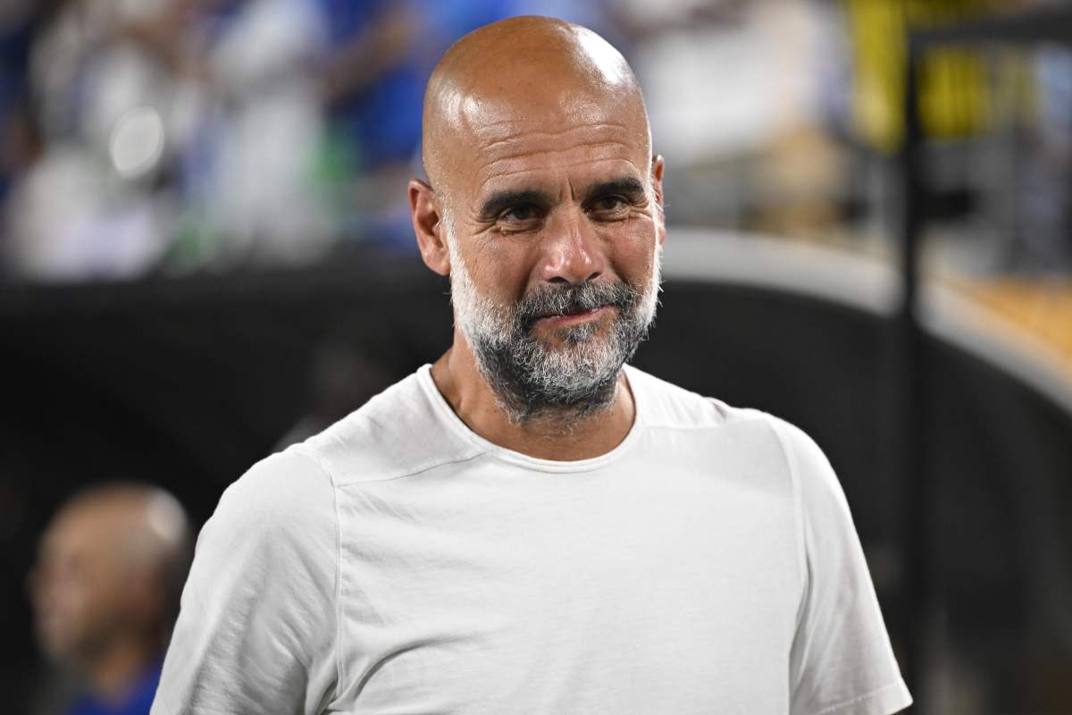 Guardiola con la faccia sorridente